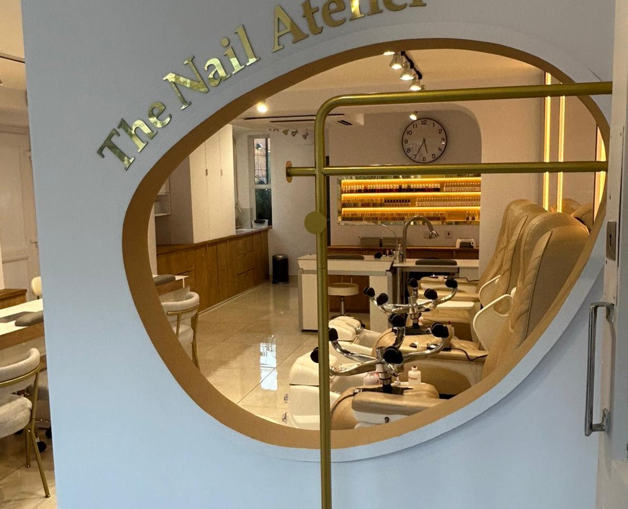 The Nail Atelier, seen through the oval window in its entrance